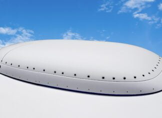 ThinKom Wideband Phased-Array Satellite Antenna Selected for MQ-4C Triton Surrogate ThinKom Ka2517 w radome on fuselage scaled